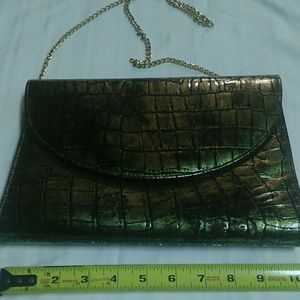 Metallic green croc. print purse.